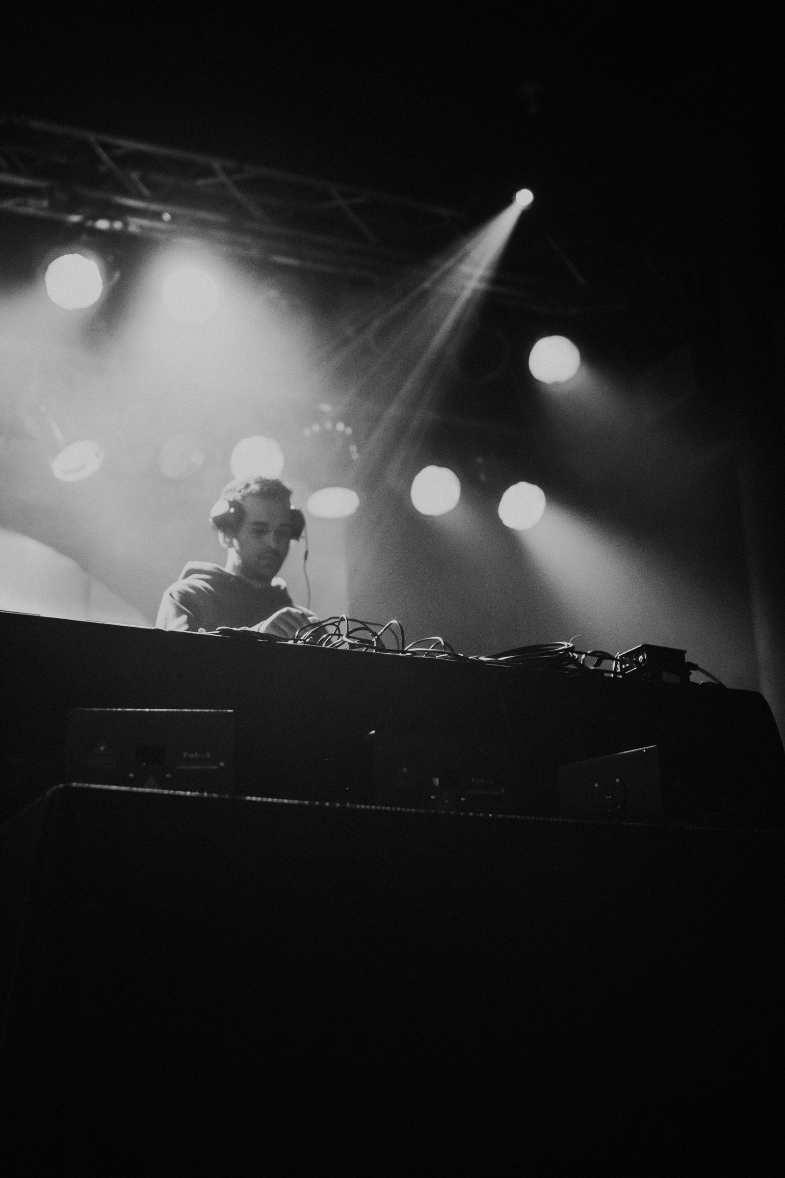 Davin Titus performing on stage under spotlights